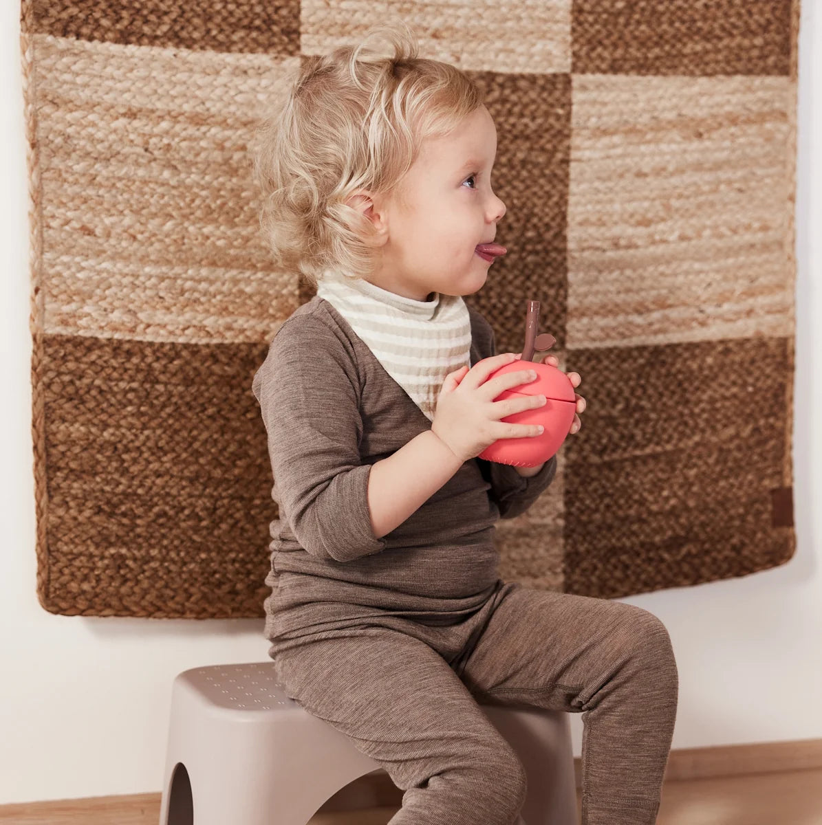 OYOY Mini Apple Cup in Cherry Red silicone with built-in straw lid