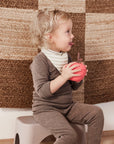 OYOY Mini Apple Cup in Cherry Red silicone with built-in straw lid