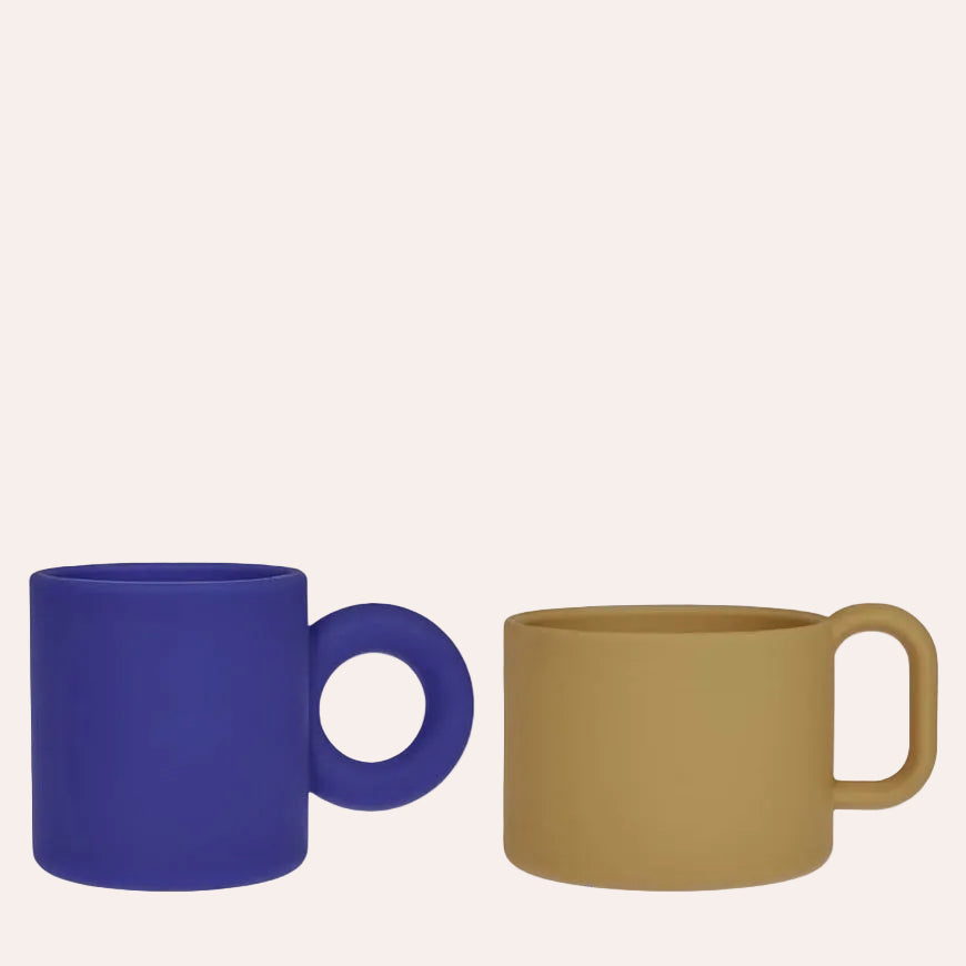 OYOY Mini Nomu silicone kids cups two pack in Blue and Caramel with easy-grip handles