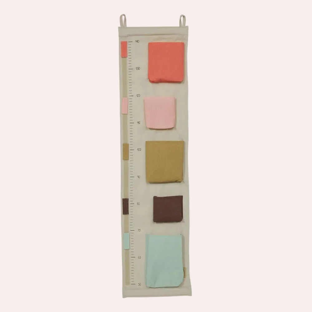 OYOY Mini Saga Growth Chart Storage in Rose with milestone markers and storage pockets